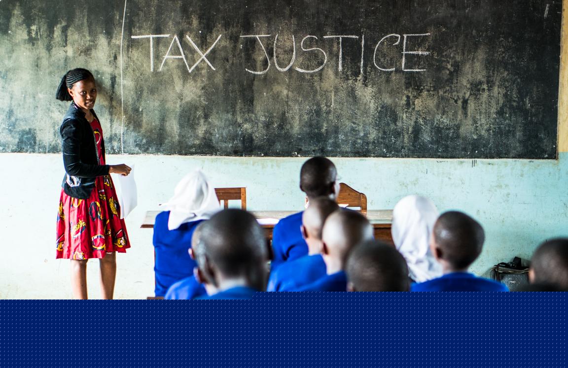 Hearing-impaired girls learning about education funding through tax justice in Tanzania.